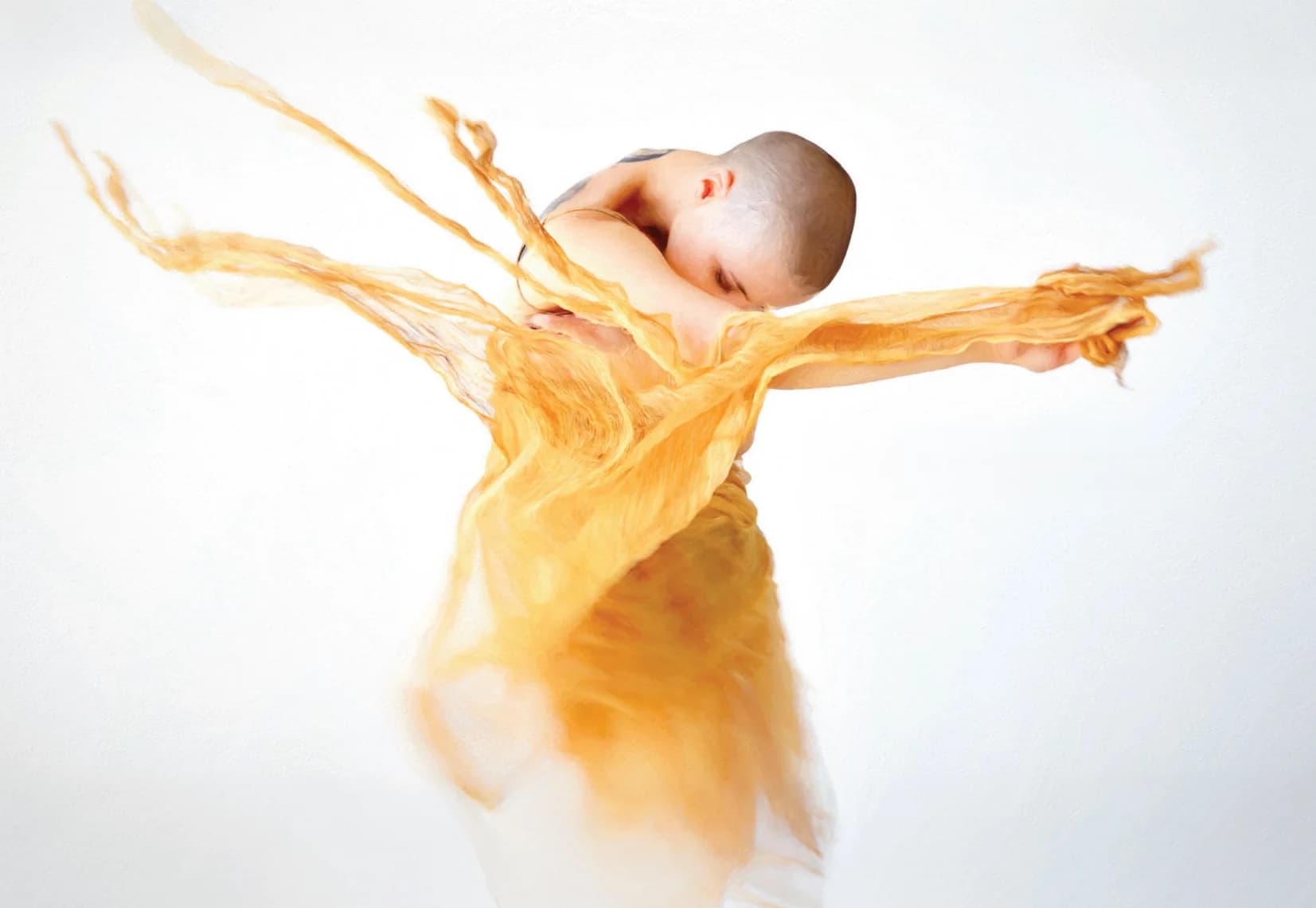 A dancer wrapped in flowing golden silk, the GoldRay brand image